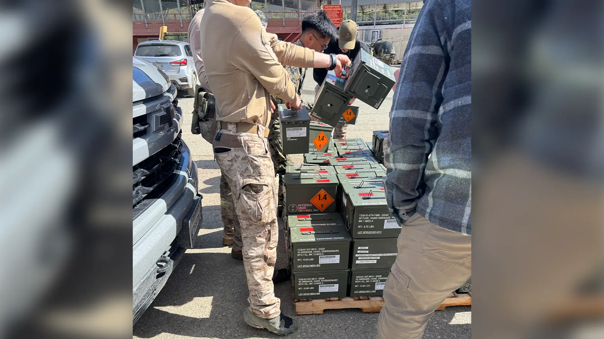 Instructors preparing demolition charges before a close-quarters battle training iteration.